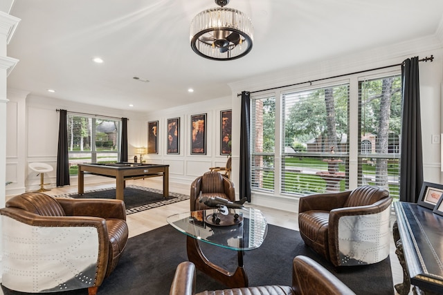 1117 Charleston Ct, Keller, TX 76248 - living room with a decorative wall, wood finished floors, a chandelier, ornamental molding, and recessed lighting