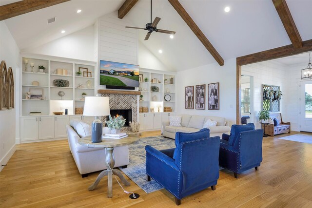 36 Mirror Lakes Ct, Gunter, TX 75058 - living area featuring beam ceiling, high vaulted ceiling, light wood-style flooring, a fireplace, and recessed lighting