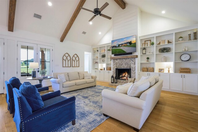 36 Mirror Lakes Ct, Gunter, TX 75058 - living area featuring ceiling fan, beam ceiling, light wood-type flooring, a fireplace, and high vaulted ceiling