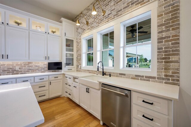 36 Mirror Lakes Ct, Gunter, TX 75058 - kitchen with stainless steel dishwasher, a sink, white cabinets, light countertops, and ceiling fan