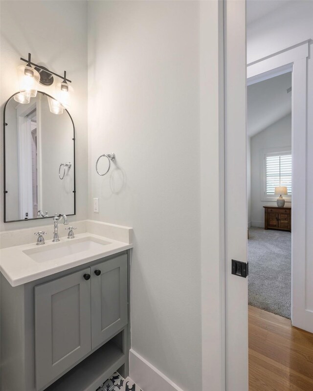 36 Mirror Lakes Ct, Gunter, TX 75058 - bathroom featuring vanity, vaulted ceiling, wood finished floors, and baseboards