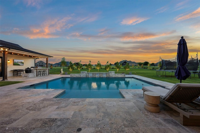 36 Mirror Lakes Ct, Gunter, TX 75058 - pool at dusk with a lawn, a patio area, an outdoor pool, and a trampoline