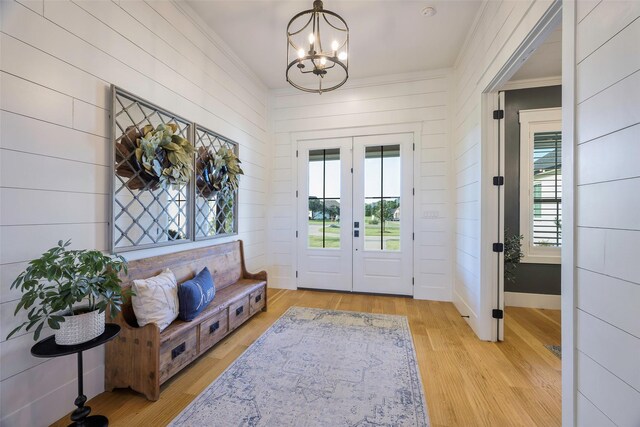 36 Mirror Lakes Ct, Gunter, TX 75058 - foyer featuring a chandelier, wood finished floors, crown molding, baseboards, and wooden walls