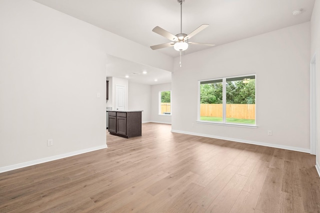 104 Southgate Dr, Terrell, TX 75160 - unfurnished living room featuring light wood-type flooring, a ceiling fan, baseboards, and recessed lighting