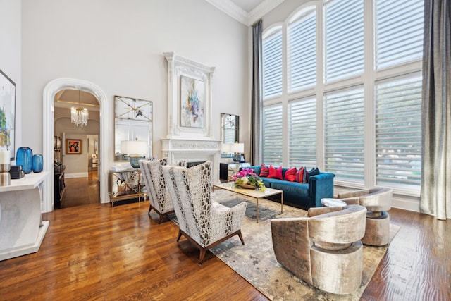504 Bristol Dr, Allen, TX 75013 - living room with a high ceiling, healthy amount of natural light, crown molding, and wood finished floors