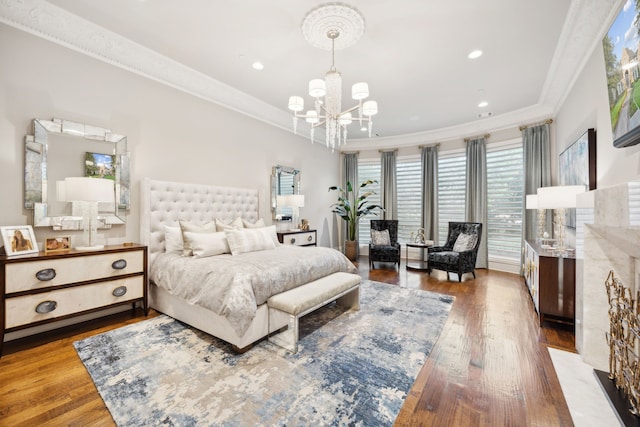504 Bristol Dr, Allen, TX 75013 - bedroom with a chandelier, crown molding, wood-type flooring, and recessed lighting