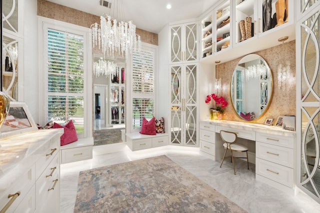 504 Bristol Dr, Allen, TX 75013 - bathroom with a chandelier, vanity, and marble tiled floors