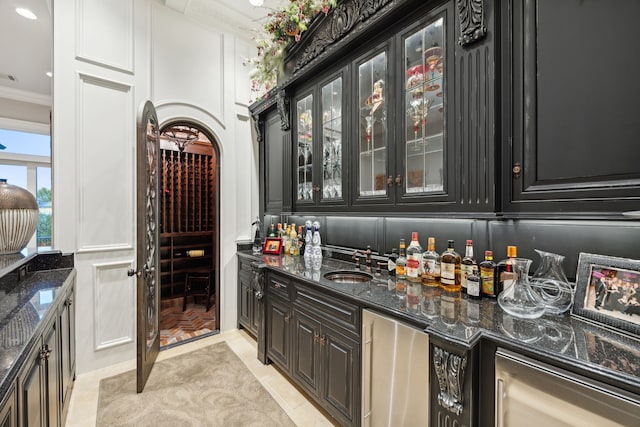 504 Bristol Dr, Allen, TX 75013 - indoor wet bar with ornamental molding, fridge, arched walkways, and recessed lighting