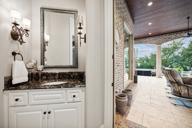 504 Bristol Dr, Allen, TX 75013 - bathroom with vanity, recessed lighting, stone tile floors, and wooden ceiling