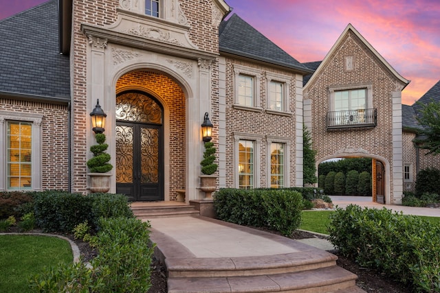 504 Bristol Dr, Allen, TX 75013 - view of exterior entry featuring brick siding and french doors