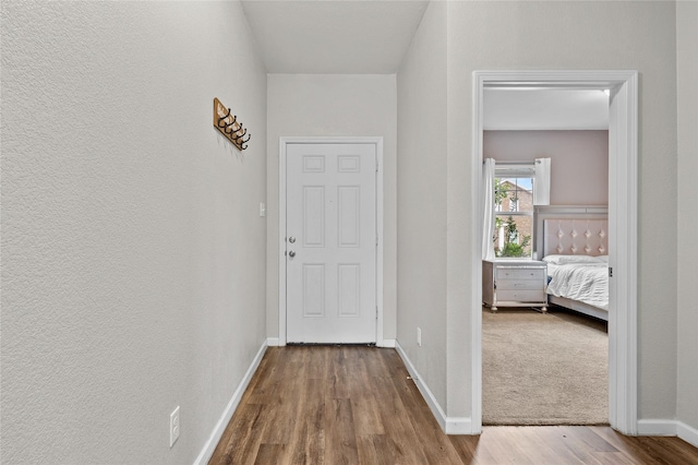 512 Leeward Ln, Crowley, TX 76036 - hallway featuring wood finished floors and baseboards