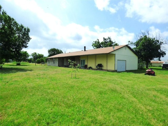 225 County Road 472, Ranger, TX 76470 - rear view of property with a yard