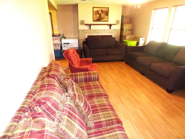 225 County Road 472, Ranger, TX 76470 - living room featuring wood finished floors and a tile fireplace