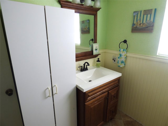 225 County Road 472, Ranger, TX 76470 - bathroom with wainscoting, vanity, and plenty of natural light