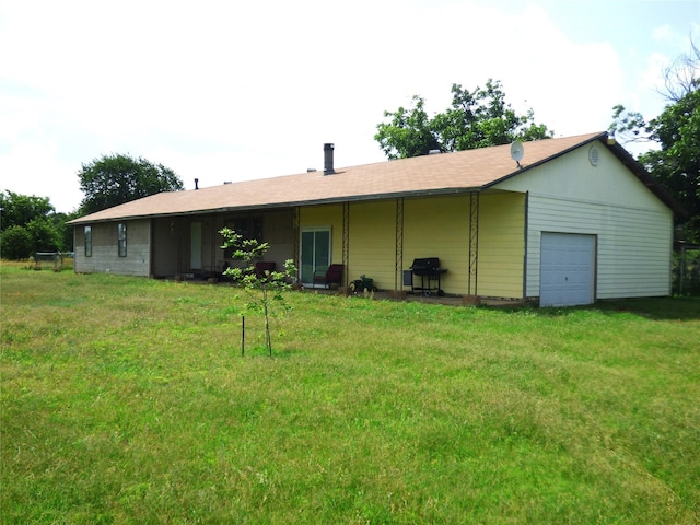225 County Road 472, Ranger, TX 76470 - rear view of house with a garage and a yard