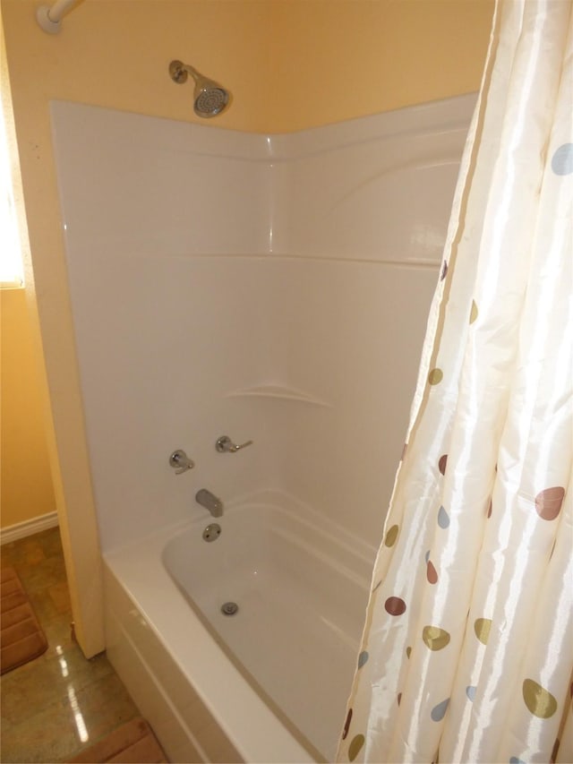 225 County Road 472, Ranger, TX 76470 - bathroom with shower / bath combination with curtain and tile patterned floors