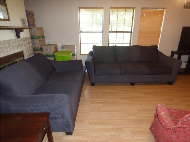 225 County Road 472, Ranger, TX 76470 - living area with light wood finished floors and a tiled fireplace