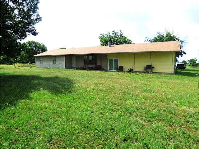 225 County Road 472, Ranger, TX 76470 - rear view of house featuring a yard