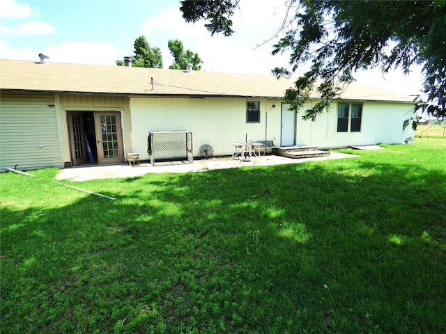 225 County Road 472, Ranger, TX 76470 - back of property with a patio and a yard