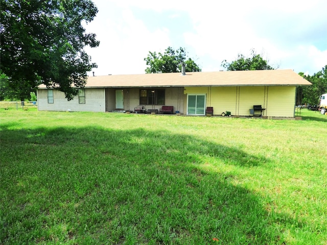 225 County Road 472, Ranger, TX 76470 - rear view of property featuring a yard