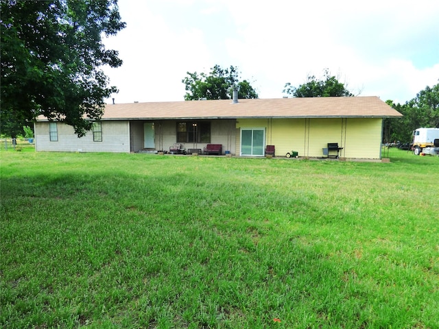 225 County Road 472, Ranger, TX 76470 - back of house featuring a lawn