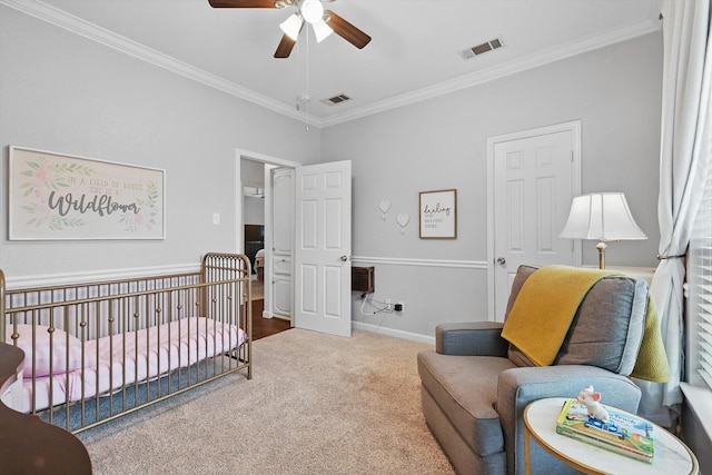 7906 Pennridge Cir, Rowlett, TX 75088 - carpeted bedroom featuring crown molding, a crib, baseboards, and a ceiling fan