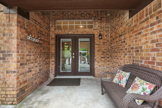 7906 Pennridge Cir, Rowlett, TX 75088 - view of exterior entry featuring french doors and brick siding