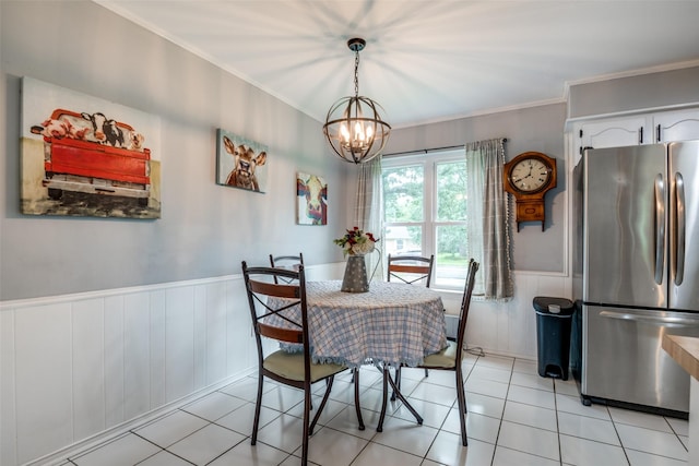 1434 Southland St, Sulphur Springs, TX 75482 - dining room featuring wainscoting, a chandelier, crown molding, and light tile patterned floors