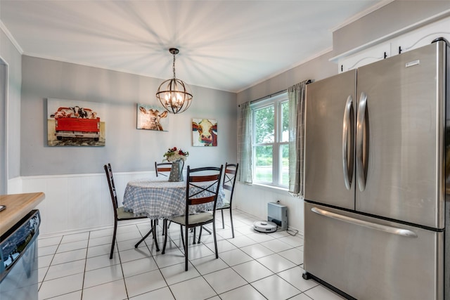 1434 Southland St, Sulphur Springs, TX 75482 - dining room featuring a chandelier, crown molding, wainscoting, and light tile patterned floors