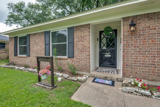 1434 Southland St, Sulphur Springs, TX 75482 - property entrance featuring a lawn and brick siding
