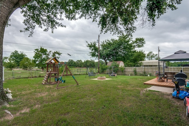 1434 Southland St, Sulphur Springs, TX 75482 - view of yard featuring a gazebo, an outdoor fire pit, a deck, and a playground