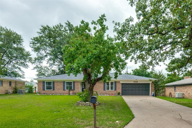 1434 Southland St, Sulphur Springs, TX 75482 - ranch-style house with a garage, concrete driveway, a front yard, and brick siding