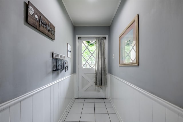 1434 Southland St, Sulphur Springs, TX 75482 - doorway to outside with wainscoting, light tile patterned flooring, and crown molding