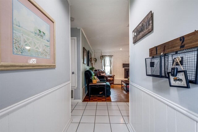 1434 Southland St, Sulphur Springs, TX 75482 - hall with wainscoting and light tile patterned flooring