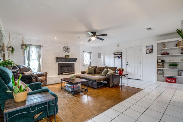 1434 Southland St, Sulphur Springs, TX 75482 - living area with ceiling fan, a brick fireplace, built in shelves, and brick wall