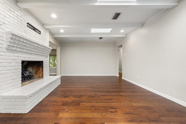 4517 Cloudview Rd, Fort Worth, TX 76109 - unfurnished living room with beamed ceiling, wood finished floors, a brick fireplace, baseboards, and recessed lighting
