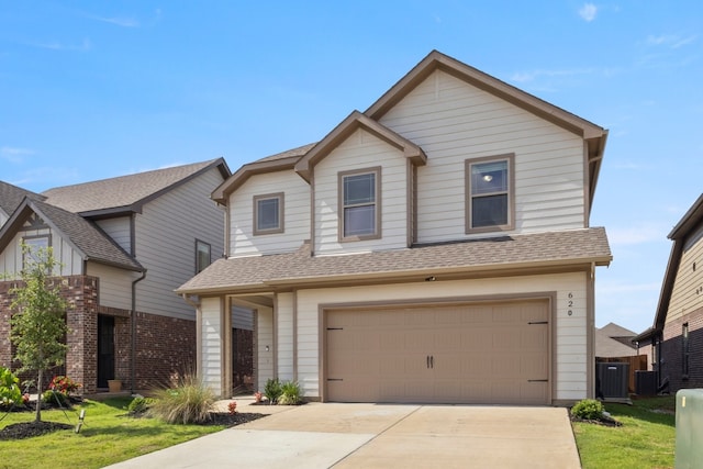 620 Ruthye Ln, Pilot Point, TX 76258 - view of front of house featuring roof with shingles, an attached garage, a front yard, driveway, and central AC unit