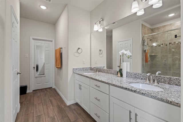 620 Ruthye Ln, Pilot Point, TX 76258 - full bath with double vanity, a stall shower, baseboards, wood finished floors, and recessed lighting
