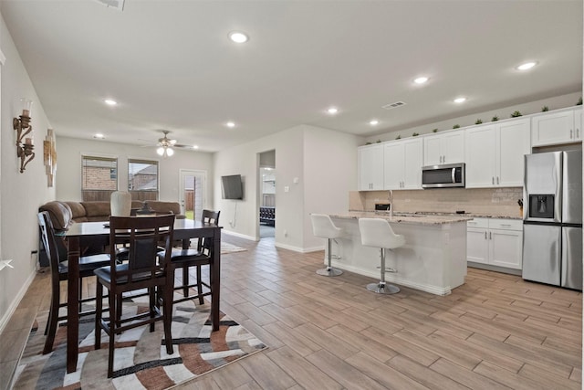 620 Ruthye Ln, Pilot Point, TX 76258 - kitchen with appliances with stainless steel finishes, tasteful backsplash, open floor plan, baseboards, and recessed lighting