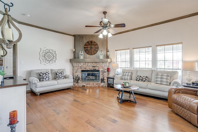 3809 Timbercrest Dr W, Burleson, TX 76028 - living area with crown molding, ceiling fan, wood-type flooring, and a fireplace