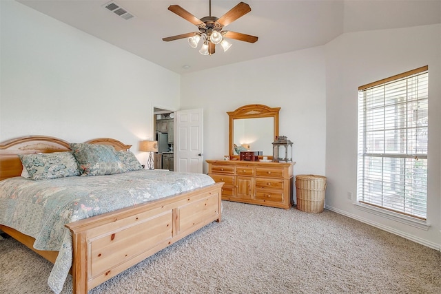 3809 Timbercrest Dr W, Burleson, TX 76028 - bedroom featuring vaulted ceiling, multiple windows, light colored carpet, baseboards, and ceiling fan