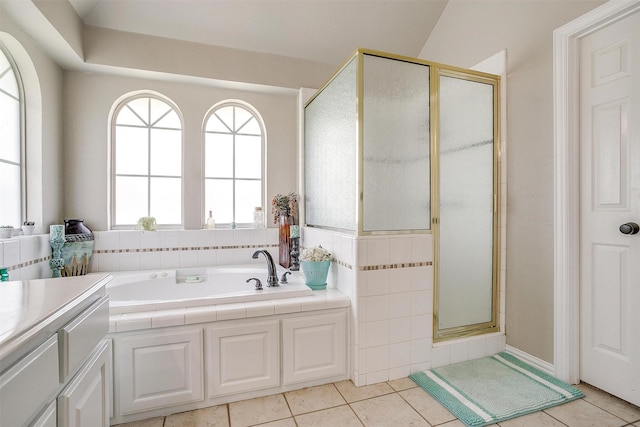 3809 Timbercrest Dr W, Burleson, TX 76028 - bathroom with plenty of natural light, a stall shower, a bath, and tile patterned flooring