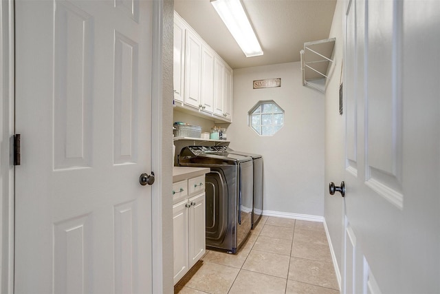 3809 Timbercrest Dr W, Burleson, TX 76028 - laundry area with cabinet space, independent washer and dryer, light tile patterned floors, and baseboards