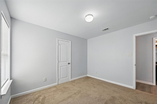 4811 Pachuca Ct, Dallas, TX 75236 - carpeted spare room featuring healthy amount of natural light, a smoke detector, and baseboards