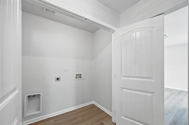4811 Pachuca Ct, Dallas, TX 75236 - laundry area featuring dark wood-type flooring, hookup for a washing machine, hookup for an electric dryer, hookup for a gas dryer, and baseboards