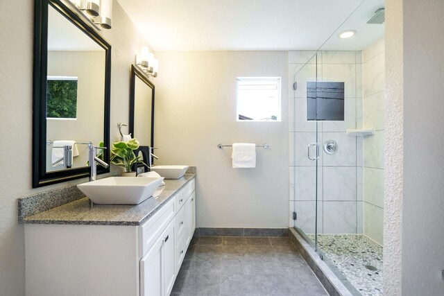 4731 Wateka Dr, Dallas, TX 75209 - full bath with double vanity, a stall shower, and baseboards