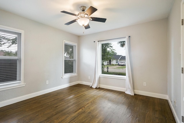4731 Wateka Dr, Dallas, TX 75209 - empty room featuring plenty of natural light, dark wood-type flooring, and baseboards