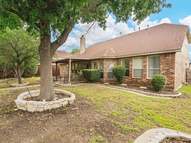 6915 Westside Pl, Sachse, TX 75048 - back of house featuring brick siding, a chimney, and a shingled roof