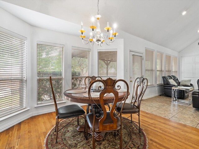 6915 Westside Pl, Sachse, TX 75048 - dining space featuring a chandelier, baseboards, lofted ceiling, and light wood-style flooring