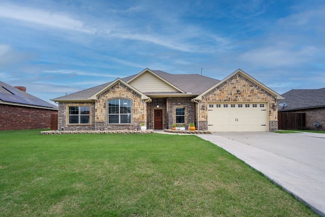 2503 Hollon Dr, Caddo Mills, TX 75135 - view of front of home featuring concrete driveway, an attached garage, a front lawn, and stone siding